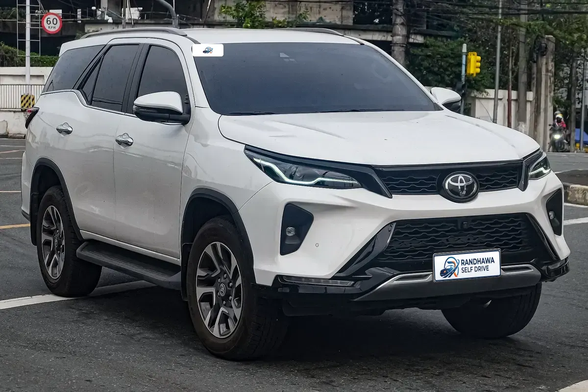 White Toyota Fortuner Legender SUV on a city street